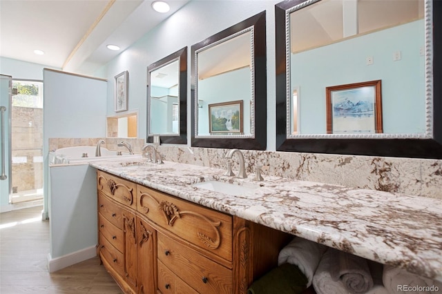 bathroom featuring vanity and hardwood / wood-style flooring