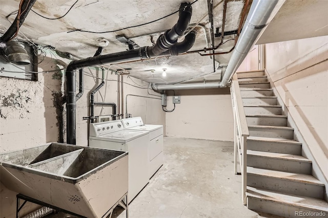 basement with sink and separate washer and dryer