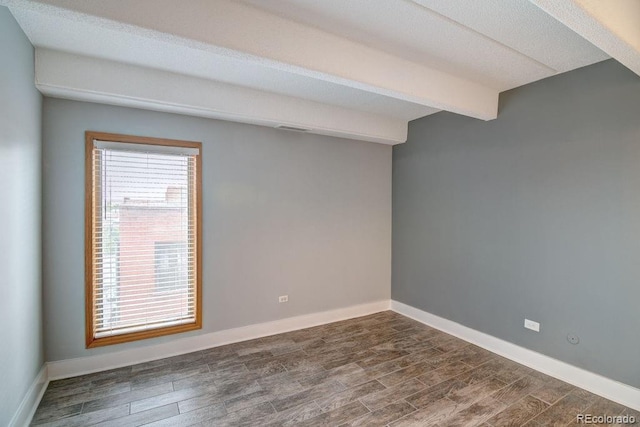 empty room with dark hardwood / wood-style flooring