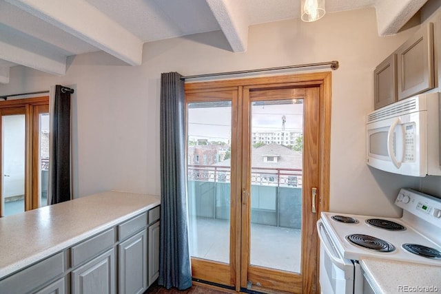 kitchen with gray cabinetry, beamed ceiling, and white appliances