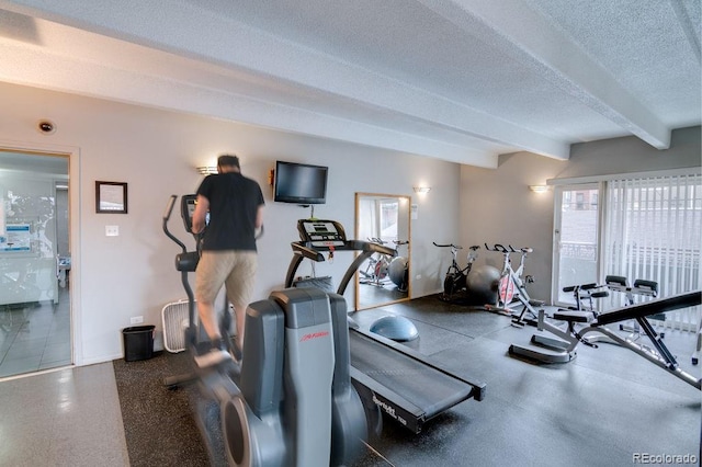 gym featuring a textured ceiling