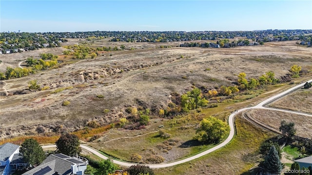 birds eye view of property with a rural view