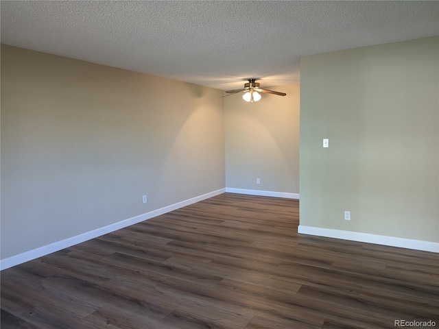 spare room with dark wood-type flooring, a textured ceiling, and ceiling fan