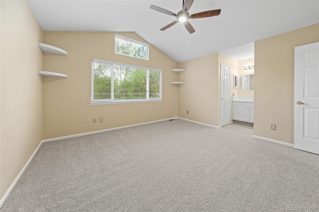 3565 W 112th Cir, Westminster, CO 80031 - unfurnished bedroom featuring light carpet, vaulted ceiling, baseboards, connected bathroom, and a ceiling fan