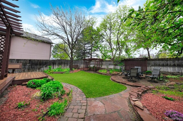 3565 W 112th Cir, Westminster, CO 80031 - view of yard with a wooden deck and a patio area