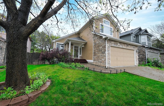 3565 W 112th Cir, Westminster, CO 80031 - view of front facade with stone siding, a garage, and concrete driveway
