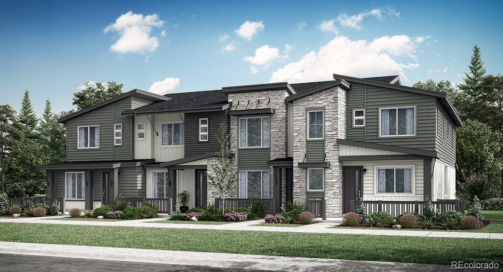 14578 W 90th Ln Unit C, Arvada, CO 80005 - view of front facade with a front yard