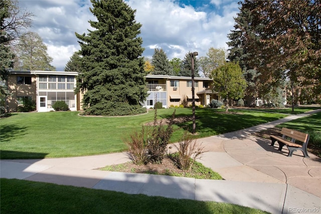 view of home's community featuring a lawn