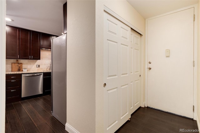 hall with dark wood-style flooring