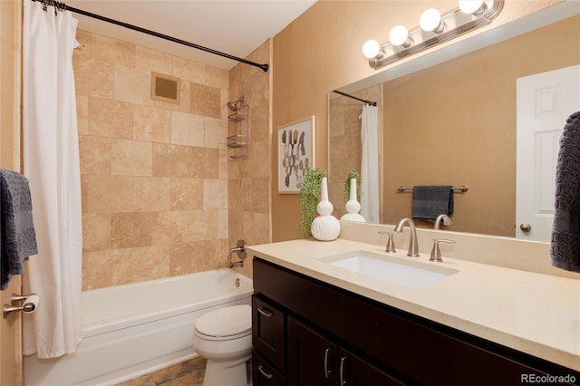 bathroom with vanity, toilet, visible vents, and shower / tub combo with curtain