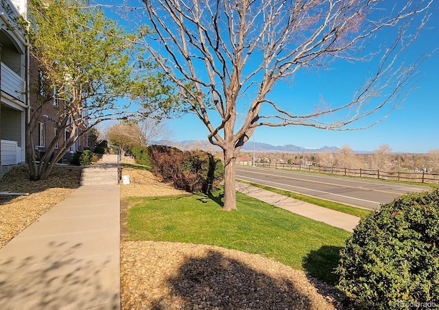 10149 W 55th Dr Unit 3, Arvada, CO 80002 - view of asphalt road featuring sidewalks and a mountain view