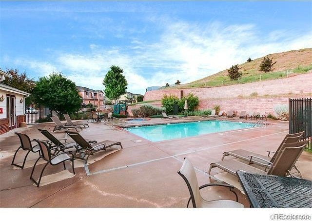 10149 W 55th Dr Unit 3, Arvada, CO 80002 - community pool with a patio area and a community hot tub