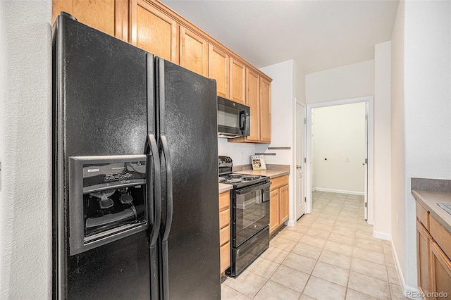 10149 W 55th Dr Unit 3, Arvada, CO 80002 - kitchen featuring black appliances, light tile patterned flooring, baseboards, light countertops, and light brown cabinetry