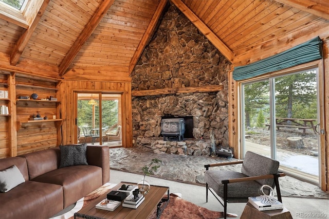 600 Rock Lake Rd, Ward, CO 80481 - living room with a skylight, beam ceiling, a wood stove, carpet, and wood ceiling