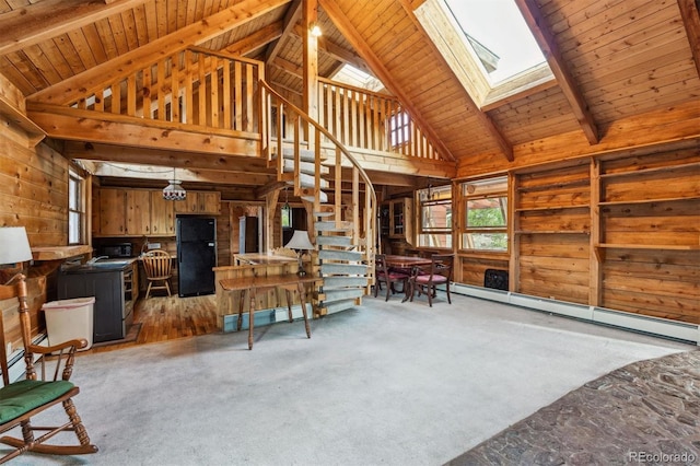 600 Rock Lake Rd, Ward, CO 80481 - living area featuring a baseboard radiator, high vaulted ceiling, stairway, beam ceiling, and a skylight
