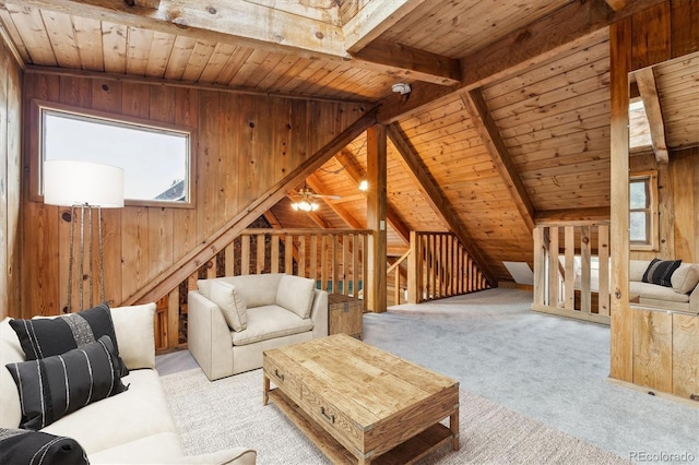600 Rock Lake Rd, Ward, CO 80481 - carpeted living room with beamed ceiling, wood walls, and wood ceiling