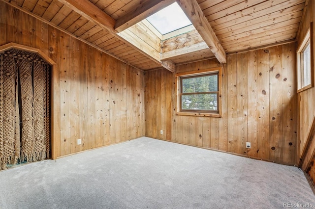 600 Rock Lake Rd, Ward, CO 80481 - carpeted empty room featuring beamed ceiling, a skylight, wooden walls, and wood ceiling
