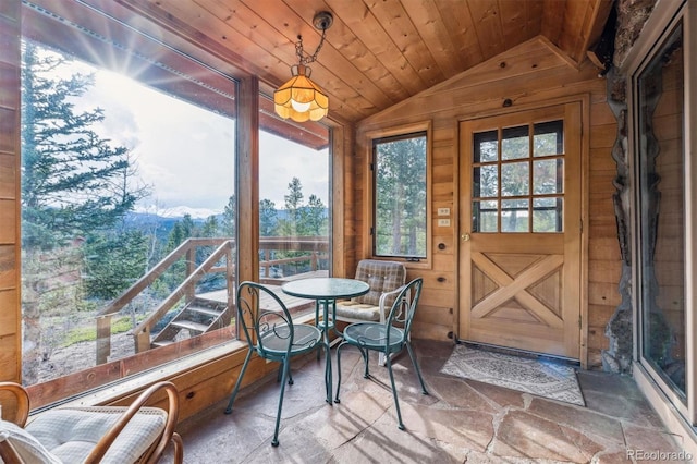 600 Rock Lake Rd, Ward, CO 80481 - sunroom / solarium featuring a mountain view, stone finish flooring, wood ceiling, wood walls, and vaulted ceiling