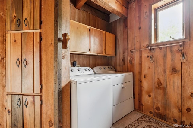 600 Rock Lake Rd, Ward, CO 80481 - washroom with cabinet space, wooden walls, and washer and dryer