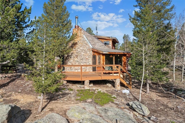 600 Rock Lake Rd, Ward, CO 80481 - rear view of property with a wooden deck and stone siding
