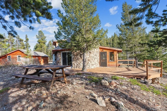 600 Rock Lake Rd, Ward, CO 80481 - back of property featuring a wooden deck and stone siding