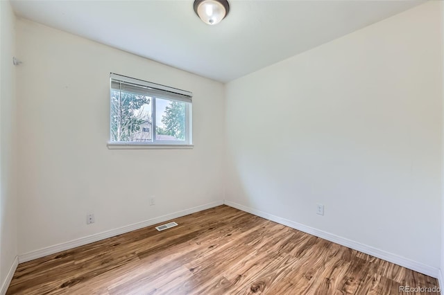 18662 E Brown Pl, Aurora, CO 80013 - spare room with wood finished floors and baseboards