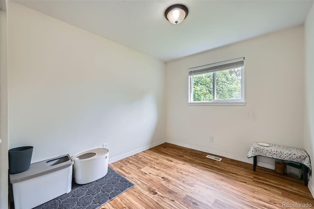 18662 E Brown Pl, Aurora, CO 80013 - spare room featuring wood finished floors and baseboards