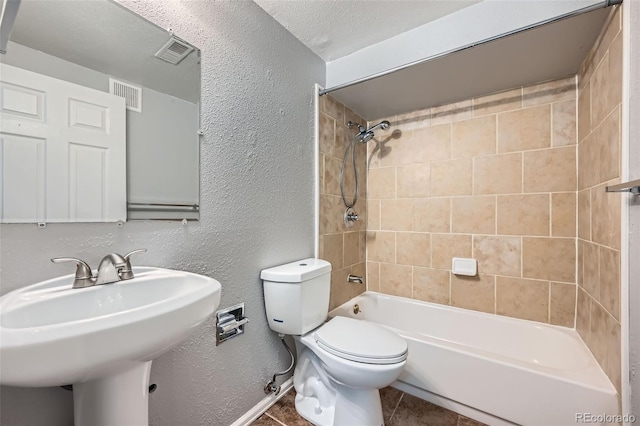 18662 E Brown Pl, Aurora, CO 80013 - bathroom with  shower combination, a textured wall, and tile patterned flooring