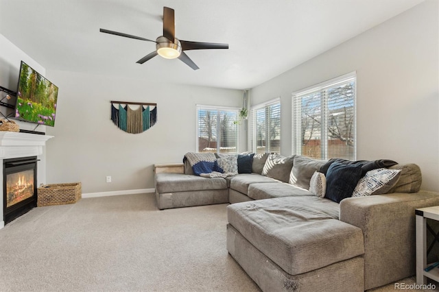 living room featuring light colored carpet and ceiling fan