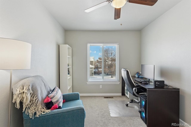 office area featuring light colored carpet and ceiling fan