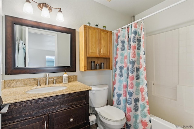 full bathroom featuring shower / bathtub combination with curtain, vanity, and toilet