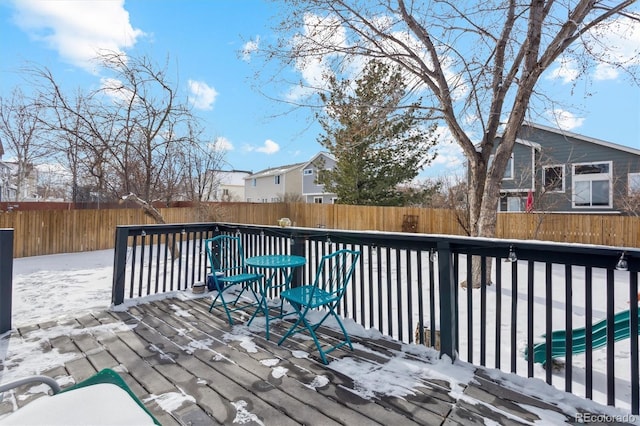 view of snow covered deck