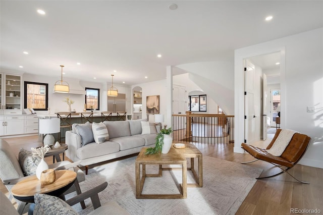 living room featuring a healthy amount of sunlight and hardwood / wood-style floors