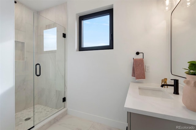 bathroom featuring vanity and an enclosed shower