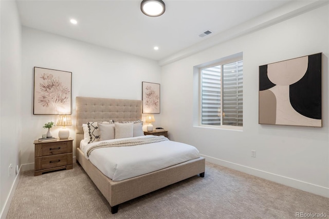 bedroom featuring light carpet