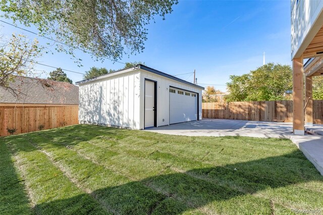 garage featuring a yard