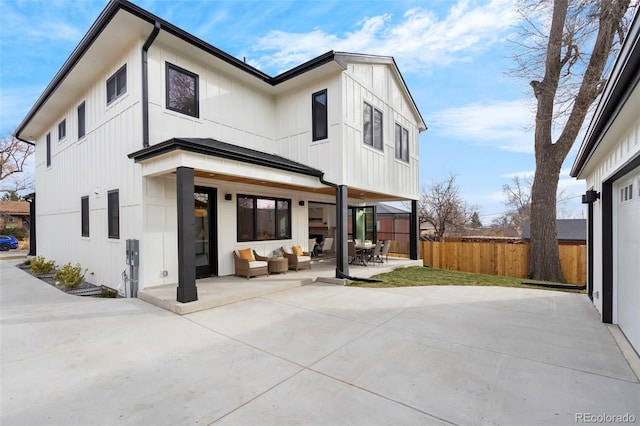 rear view of house featuring an outdoor hangout area and a patio area