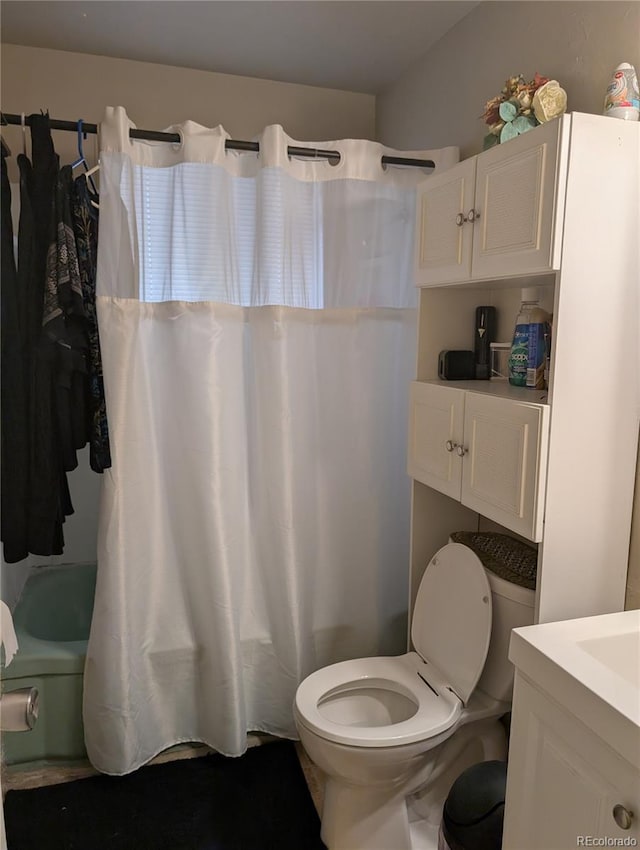 4975 Saint Paul St, Denver, CO 80216 - bathroom featuring vanity and shower / tub combo with curtain