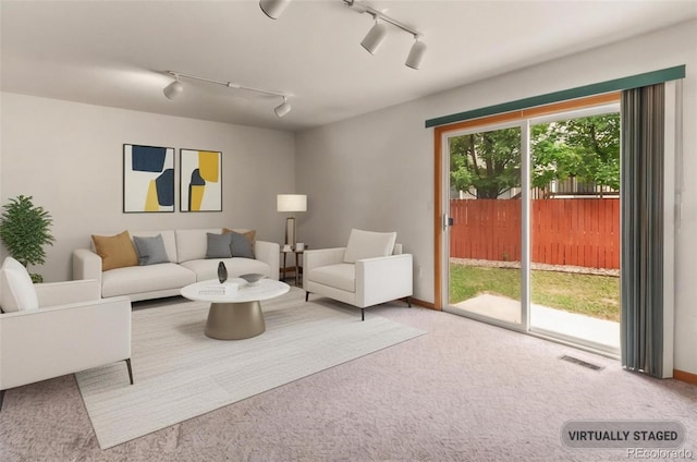 131 Morgan Ct, Loveland, CO 80537 - living room with track lighting and carpet flooring