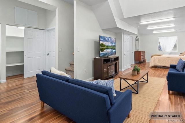 131 Morgan Ct, Loveland, CO 80537 - living room featuring wood finished floors and stairs