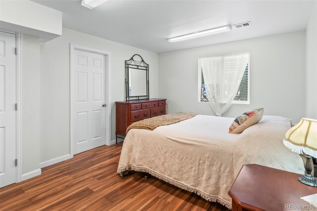 131 Morgan Ct, Loveland, CO 80537 - bedroom with dark wood-style floors and baseboards