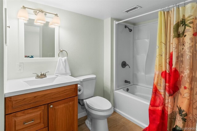 131 Morgan Ct, Loveland, CO 80537 - full bath featuring vanity, shower / bath combo, and wood finished floors