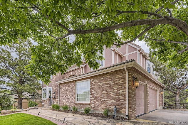 7758 Edgewater Ct, Lone Tree, CO 80124 - view of home's exterior featuring stucco siding and brick siding