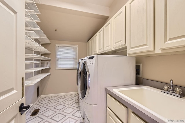 7758 Edgewater Ct, Lone Tree, CO 80124 - laundry area featuring cabinet space, washing machine and clothes dryer, and baseboards