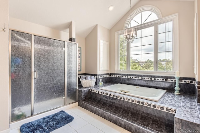 7758 Edgewater Ct, Lone Tree, CO 80124 - bathroom featuring a garden tub, a stall shower, tile patterned floors, vaulted ceiling, and a chandelier
