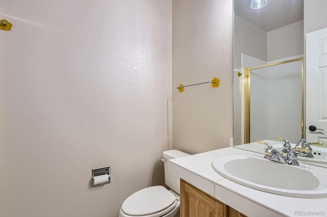 7758 Edgewater Ct, Lone Tree, CO 80124 - full bathroom with a shower stall, toilet, vanity, and a textured wall