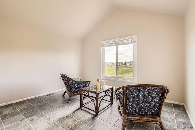 7758 Edgewater Ct, Lone Tree, CO 80124 - living area featuring vaulted ceiling and baseboards