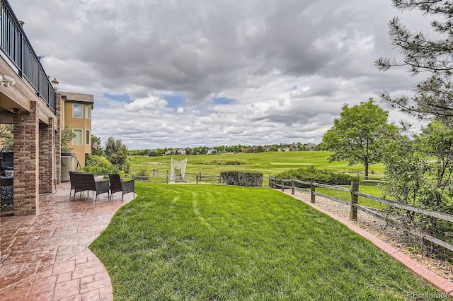 7758 Edgewater Ct, Lone Tree, CO 80124 - view of yard with a patio area and a rural view