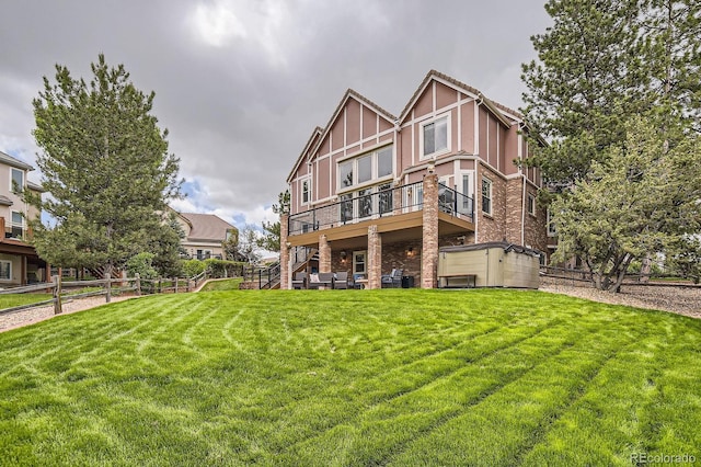 7758 Edgewater Ct, Lone Tree, CO 80124 - rear view of house with brick siding, stairway, and a deck
