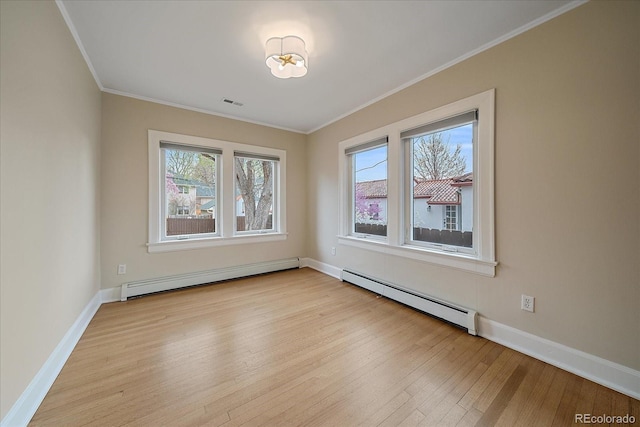 371 Birch St, Denver, CO 80220 - empty room with baseboards, wood finished floors, crown molding, and baseboard heating